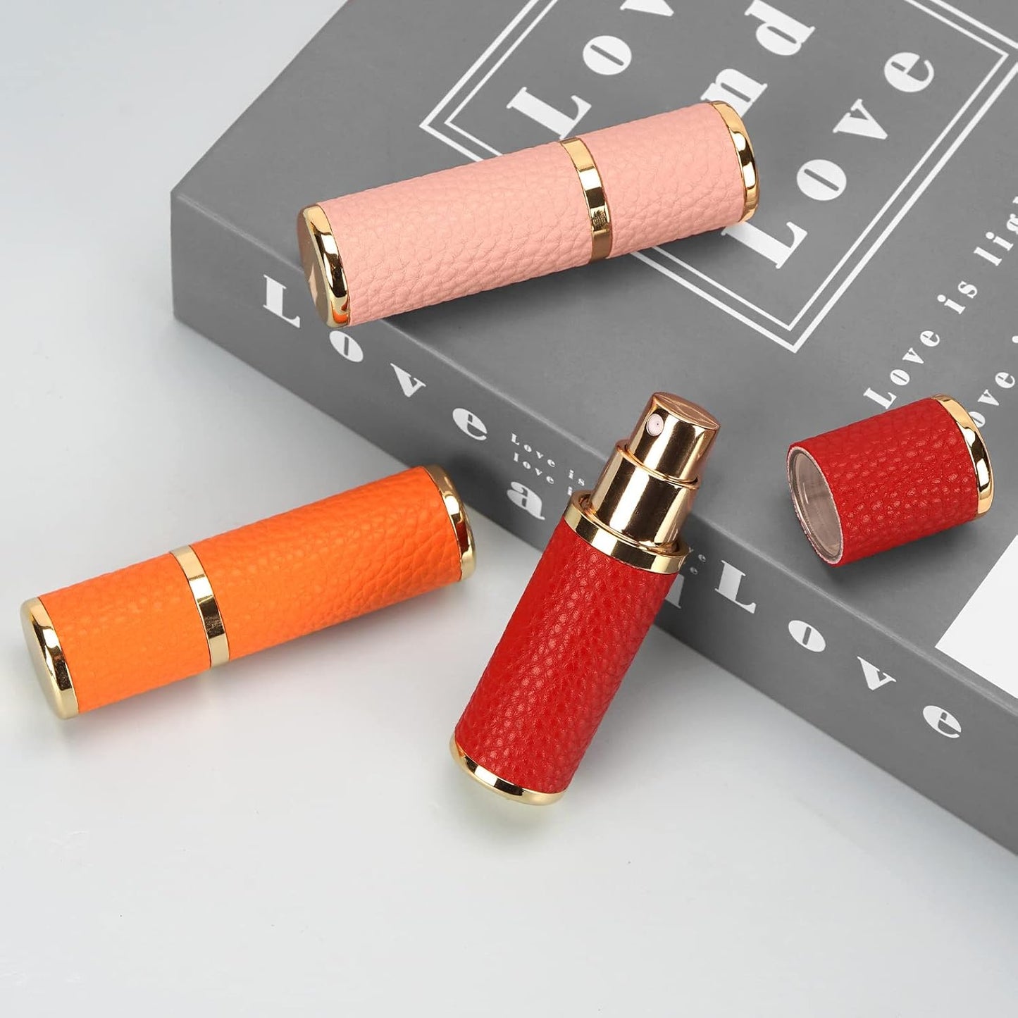 3 Pack Portable Perfume Bottle for Travel, Mini Refillable Perfume Dispenser, 5Ml Faux Leather Leak Proof Perfume Atomizers Bottles Sprayer for Pocket Perfume (Red, Pink, Orange)